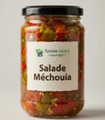 Salade méchouia tunisienne composée de tomates, piments et ail grillés au feu de bois, relevée et épicée.
